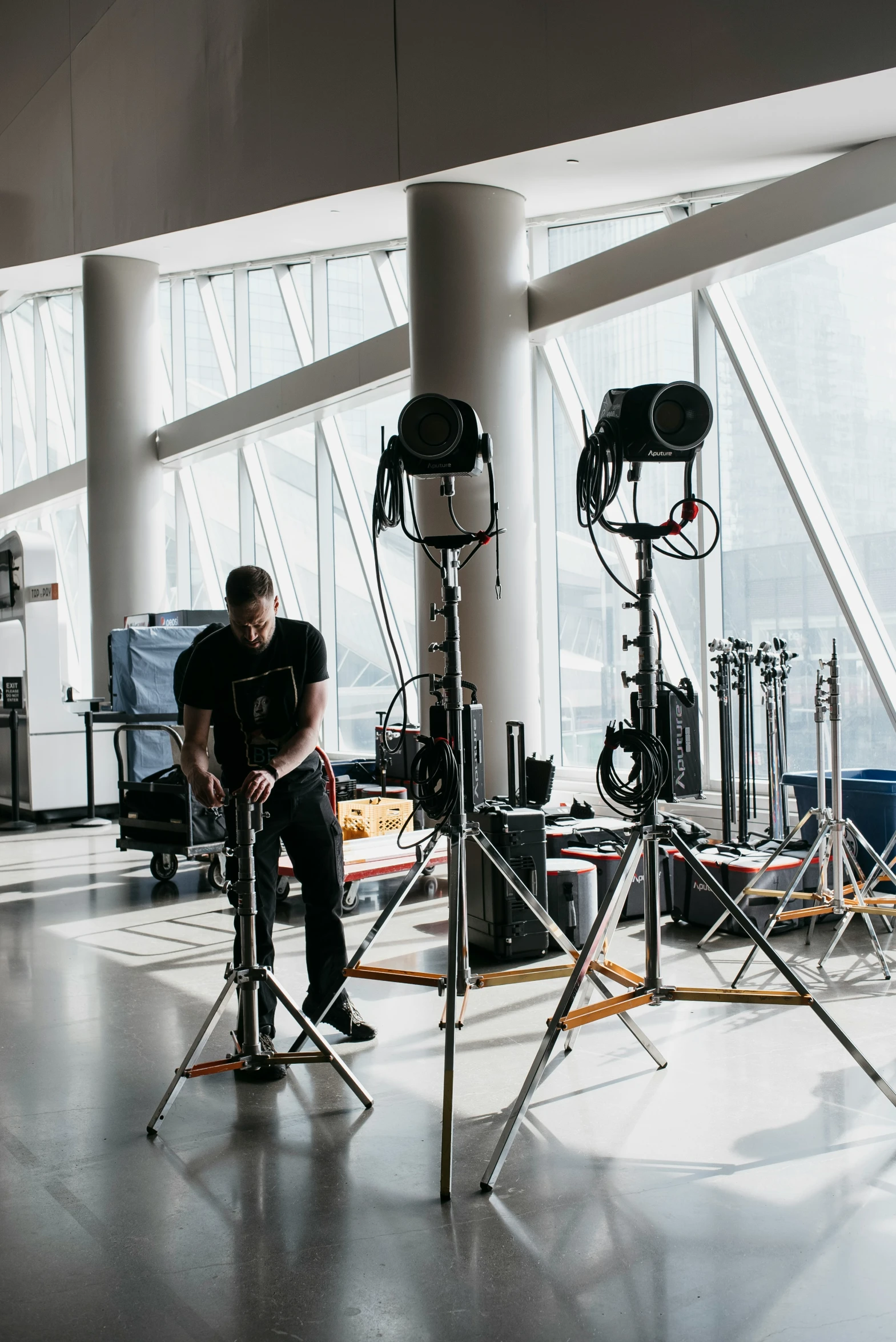 a person is posing on a camera set in the middle of an empty room