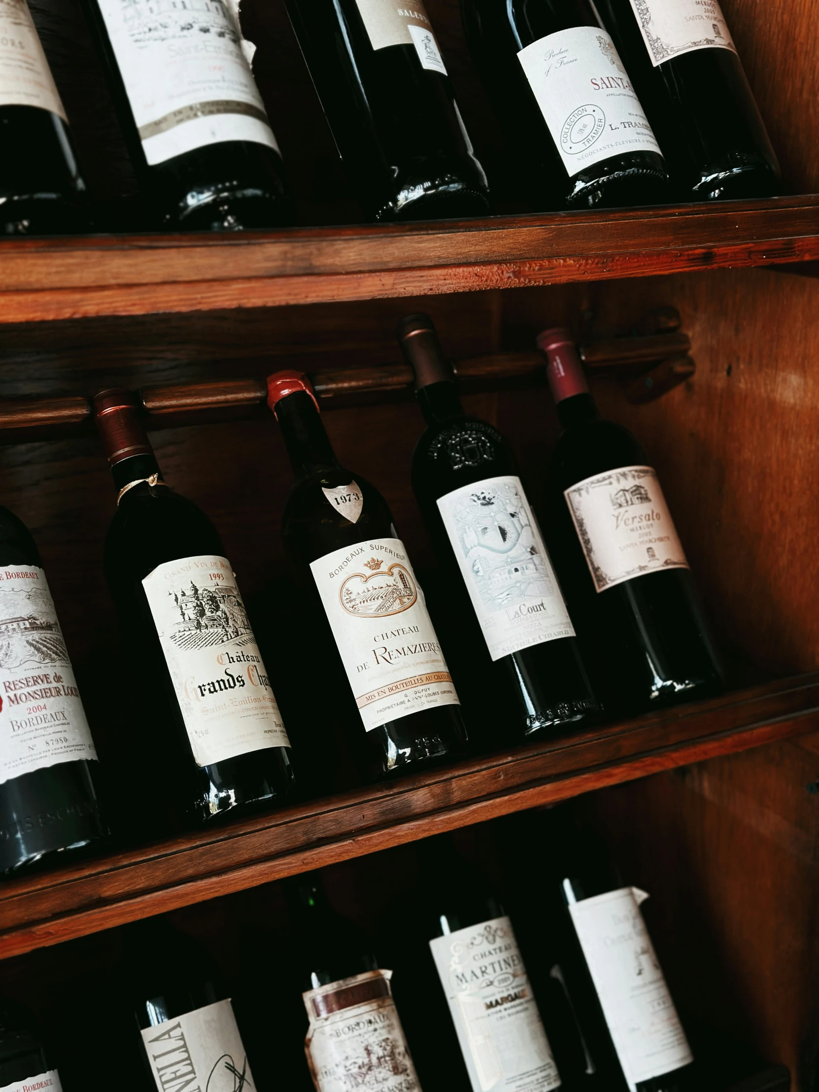 many bottles of wine on shelves in a shop