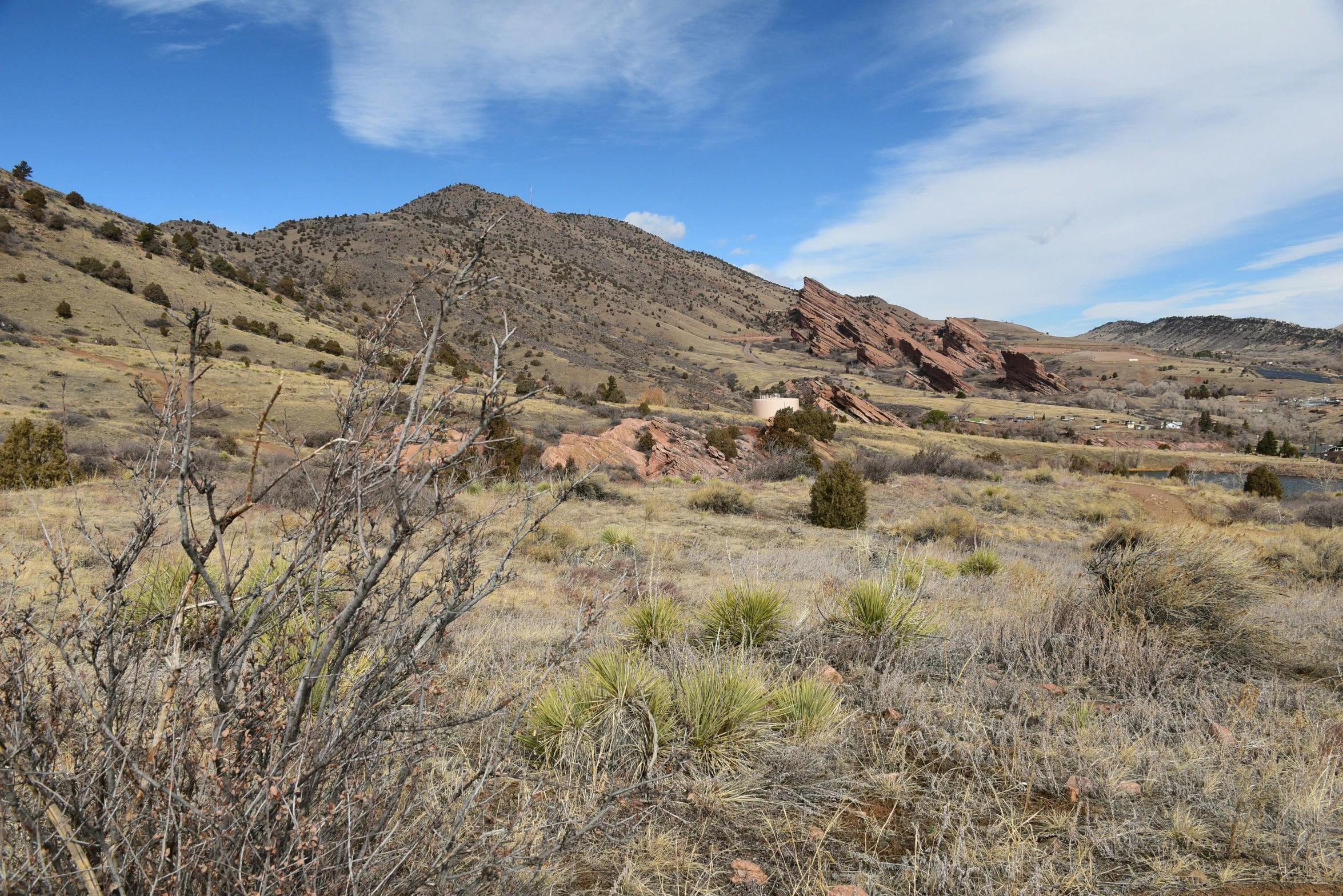 a large open plain with hills in the distance