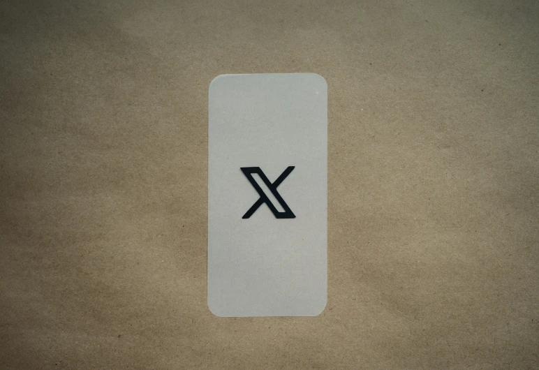 a white and black phone case with the letter x