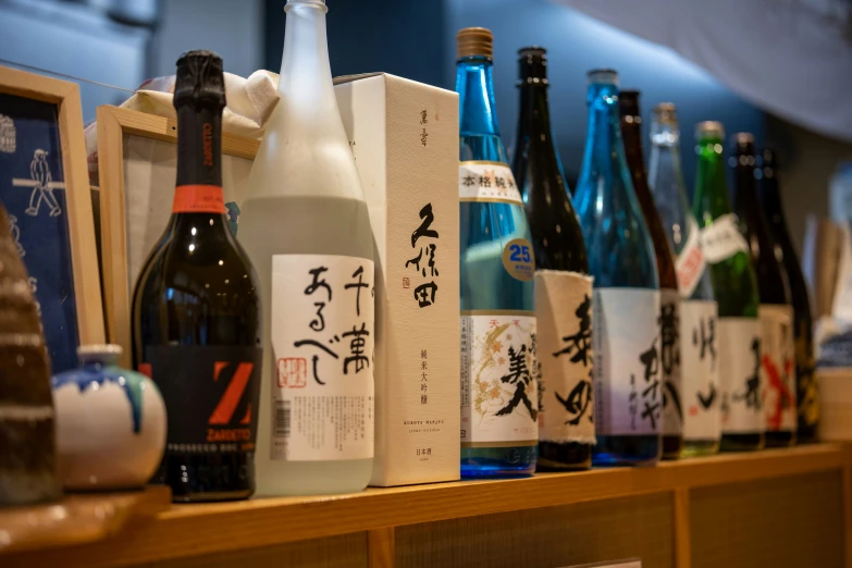 bottles are on a shelf in a japanese shop