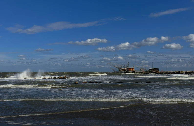 an image of a boat in the middle of the ocean