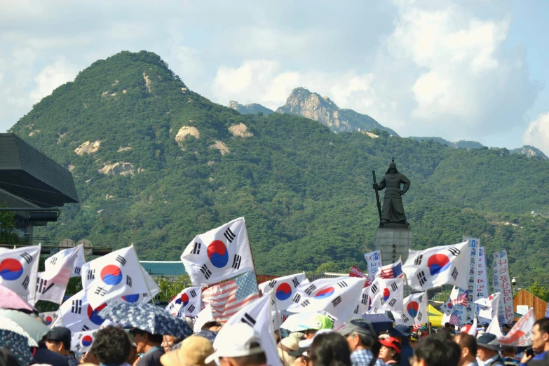 there are many flags that are being carried by people