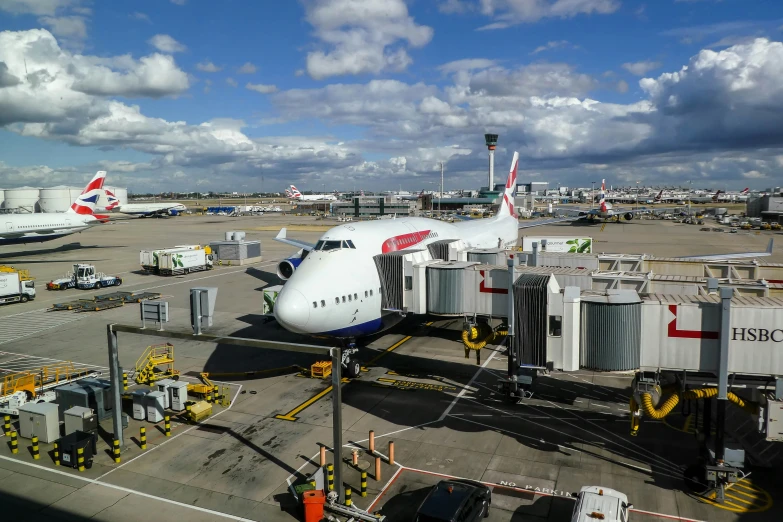 an airport with multiple airplanes parked on the tarmac