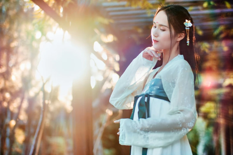 a woman is standing outside with a backpack on her shoulder