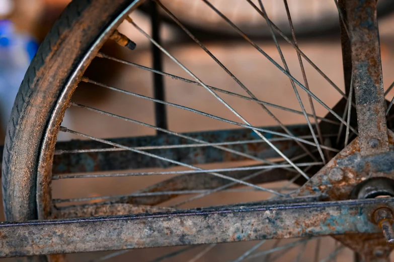 a rusty bicycle wheel from an old fashioned bike