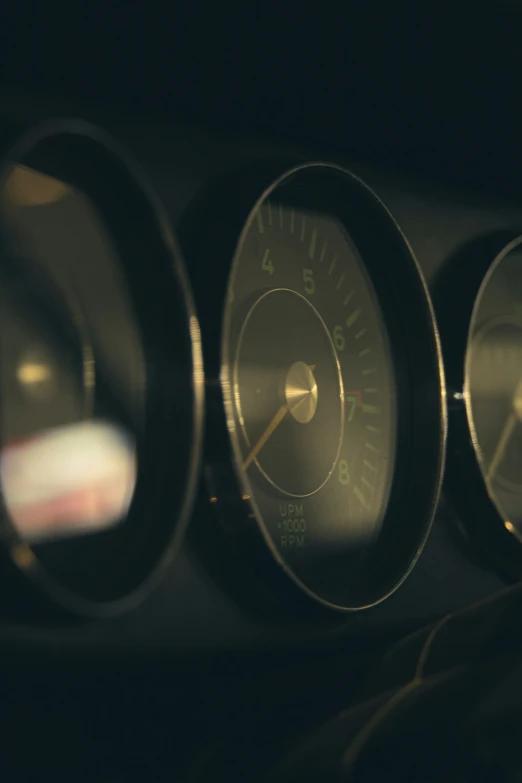 gauges on the inside of an old gas pump