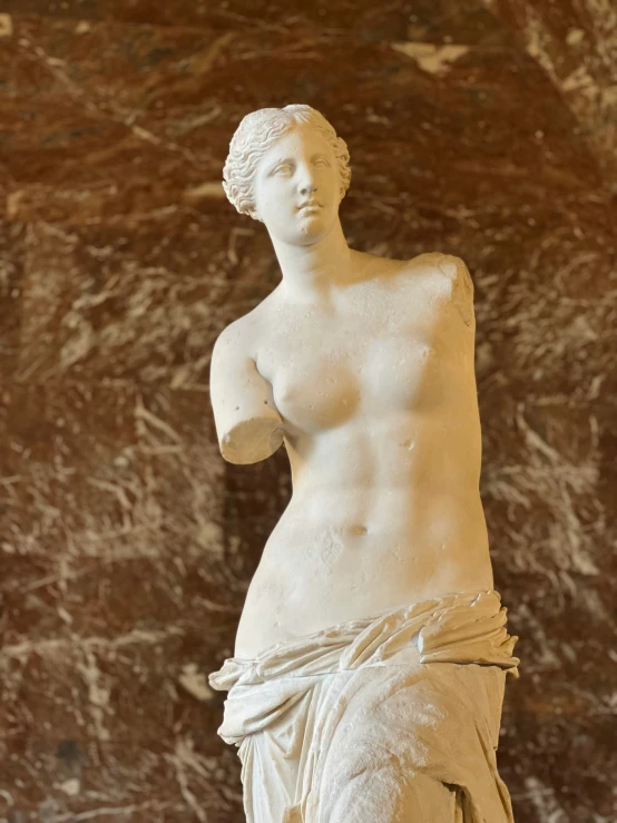 a white marble sculpture of a woman