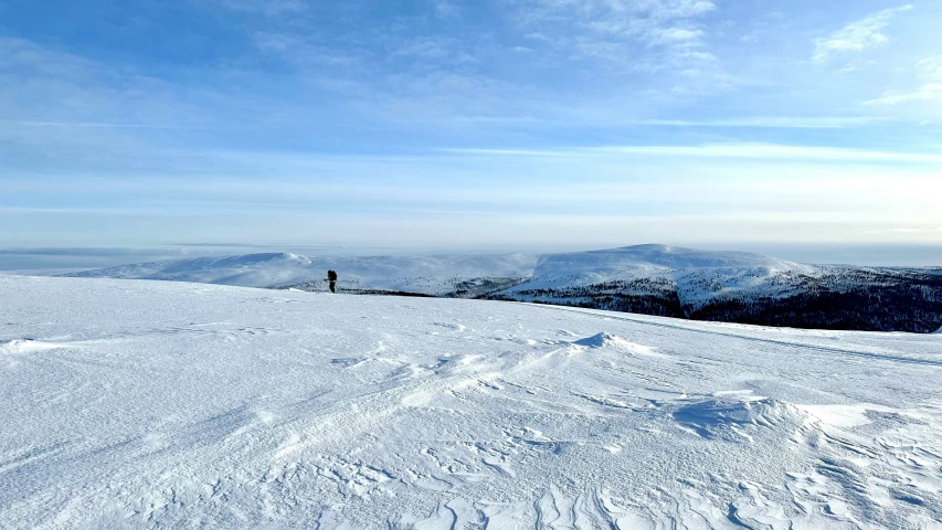 there is a snow skier that has landed on the snow