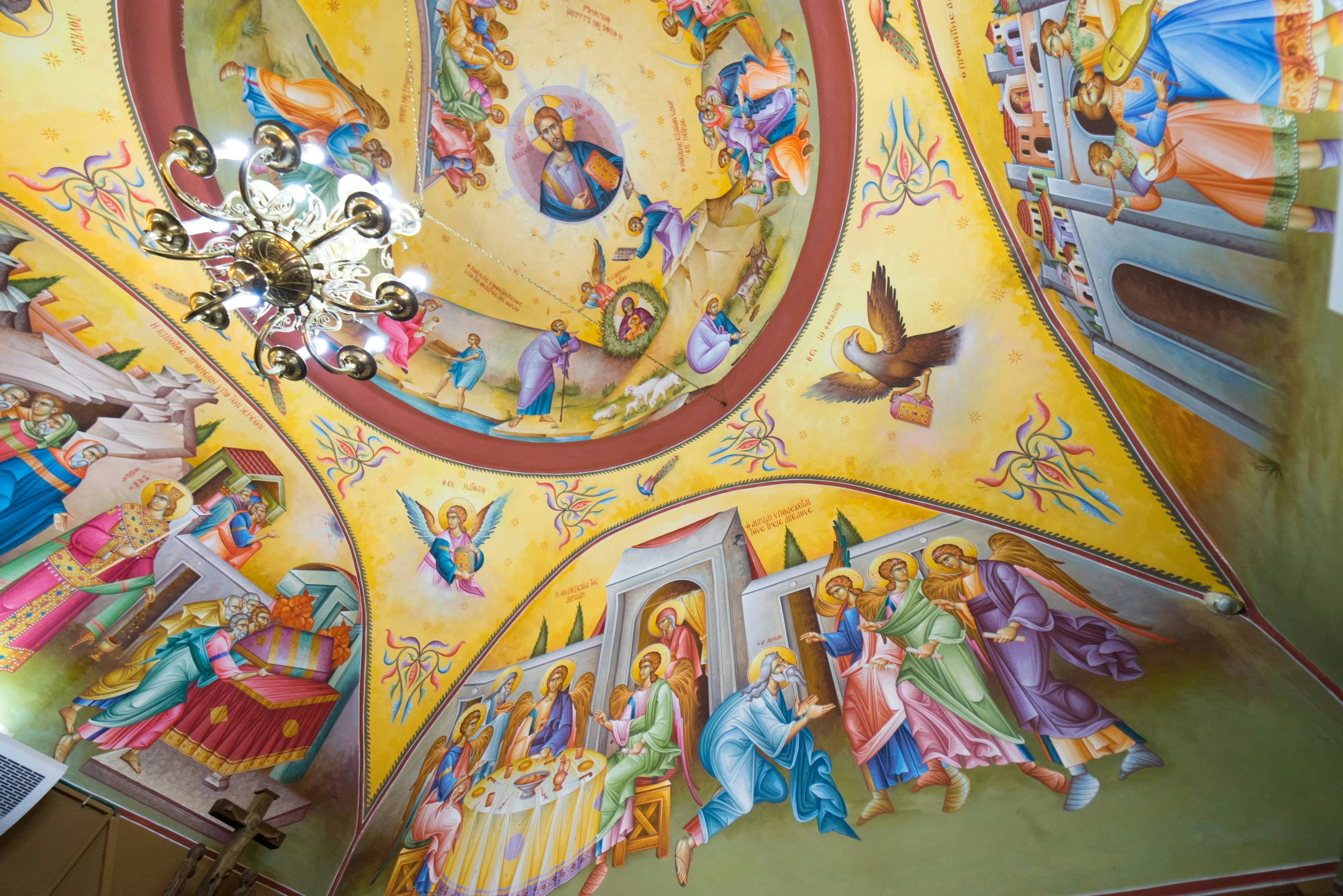 brightly painted cathedral ceiling inside a church