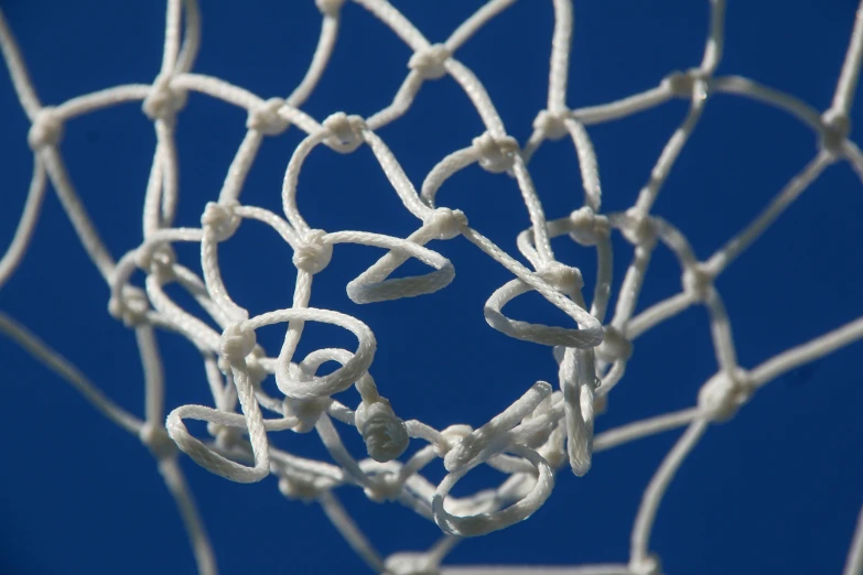 a close up of a tennis net with lots of lines