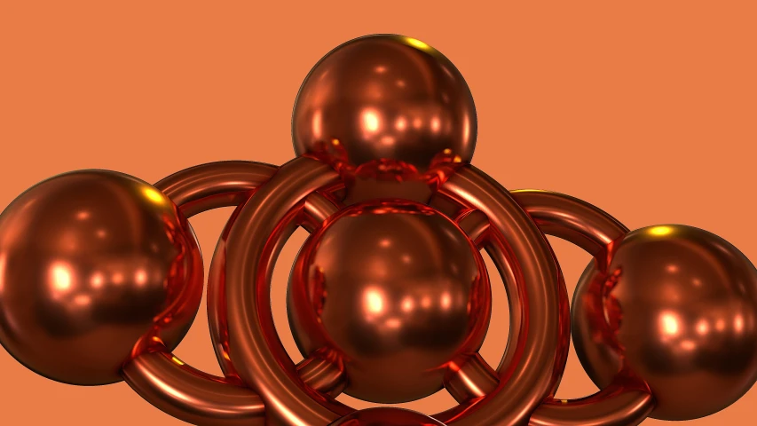 several metallic balls on an orange background