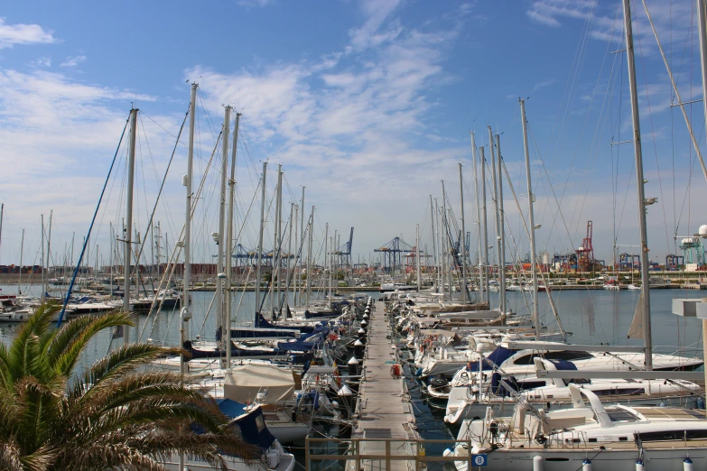 a large group of boats in the water at a harbor