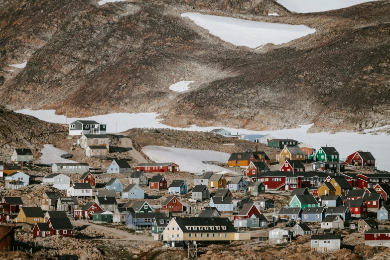 a village with some buildings built into the sides of it