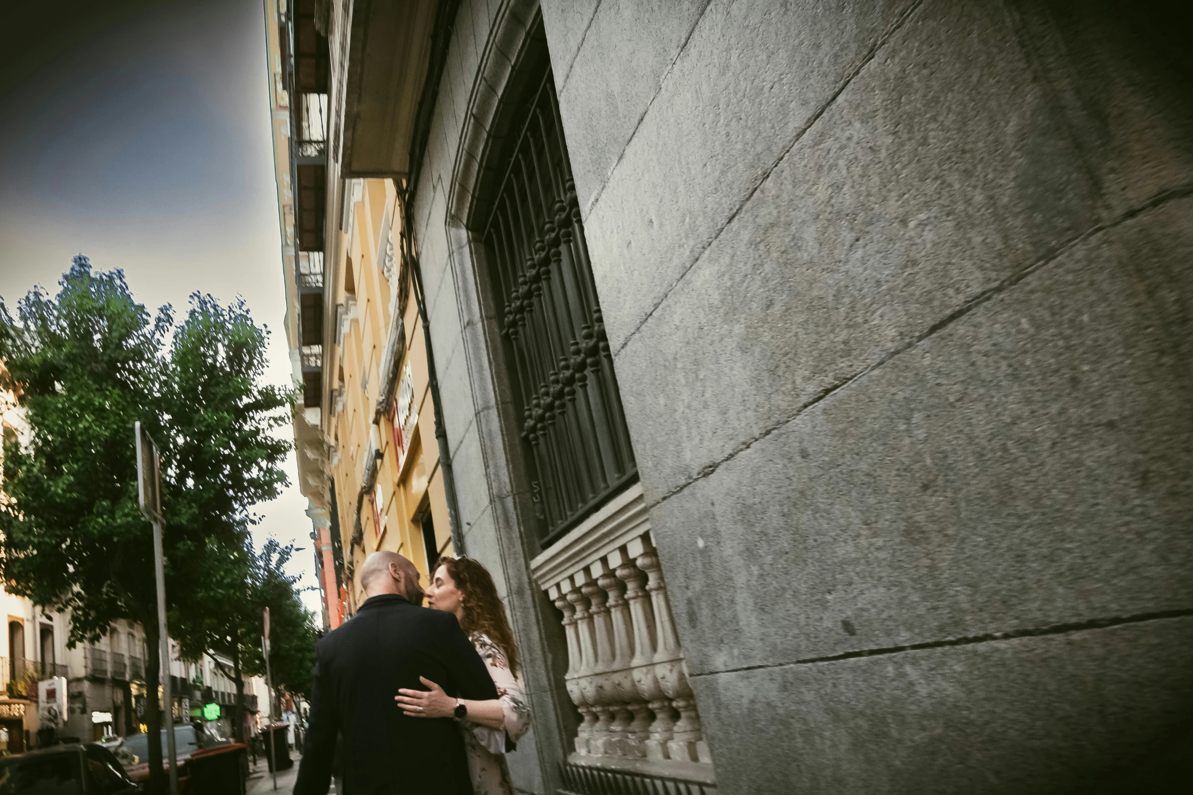 man and woman emce on the wall of an alley way in manhattan, new york city