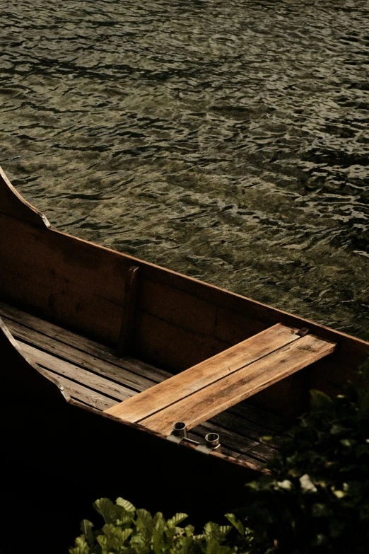 a lone rowboat is floating across the water