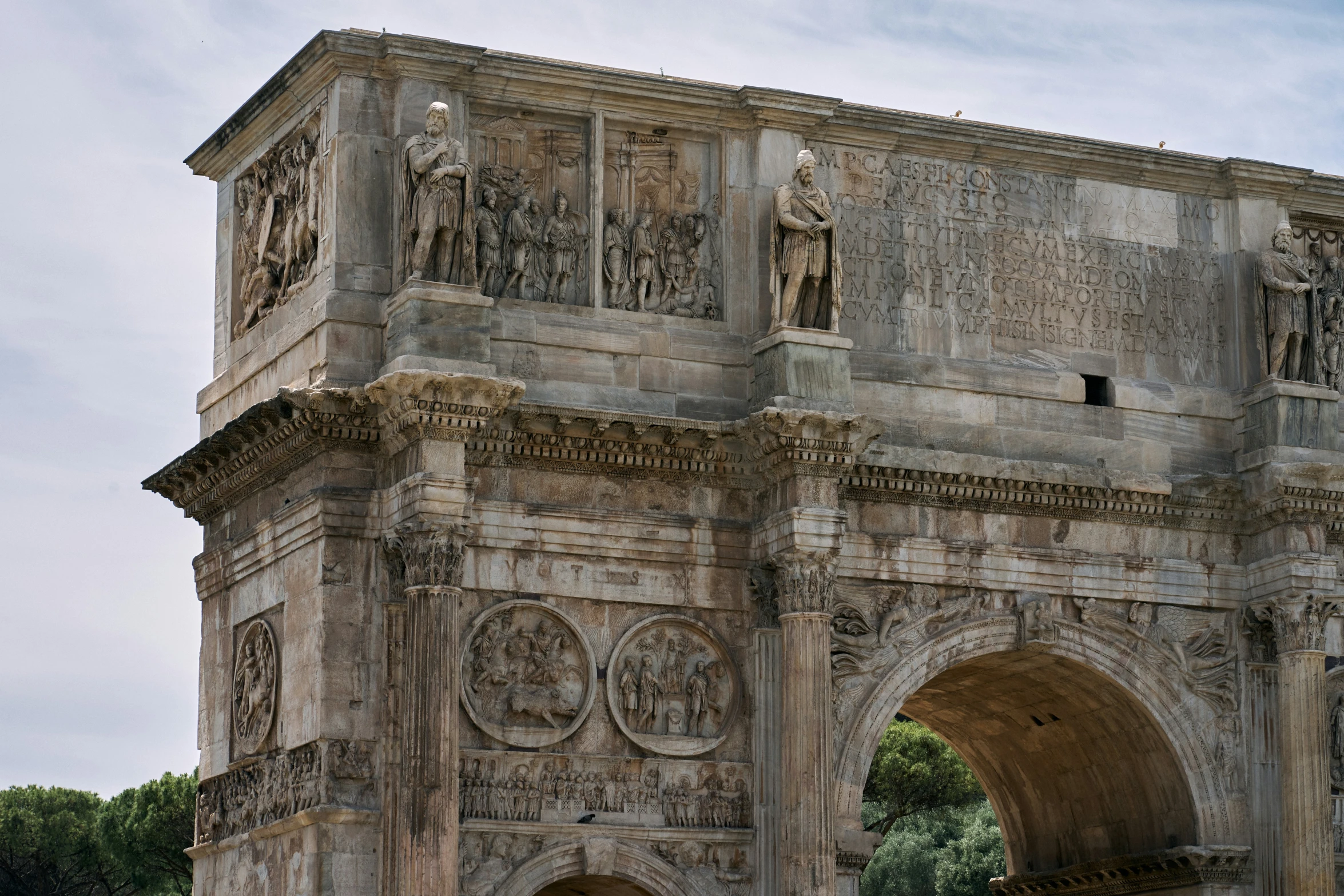 the ornate archway to an old historic, old stone structure