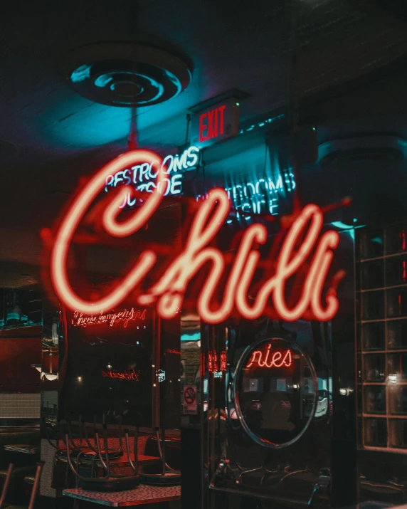 this is an illuminated neon sign for a restaurant