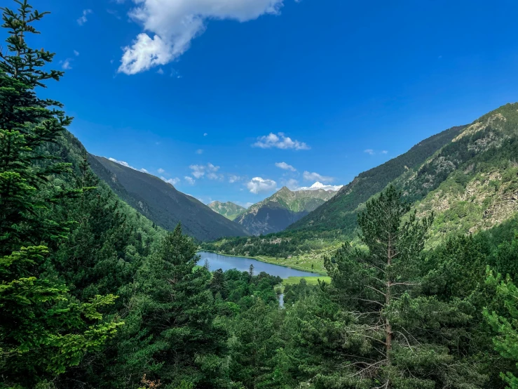 the beautiful mountain scenery is dotted by blue sky