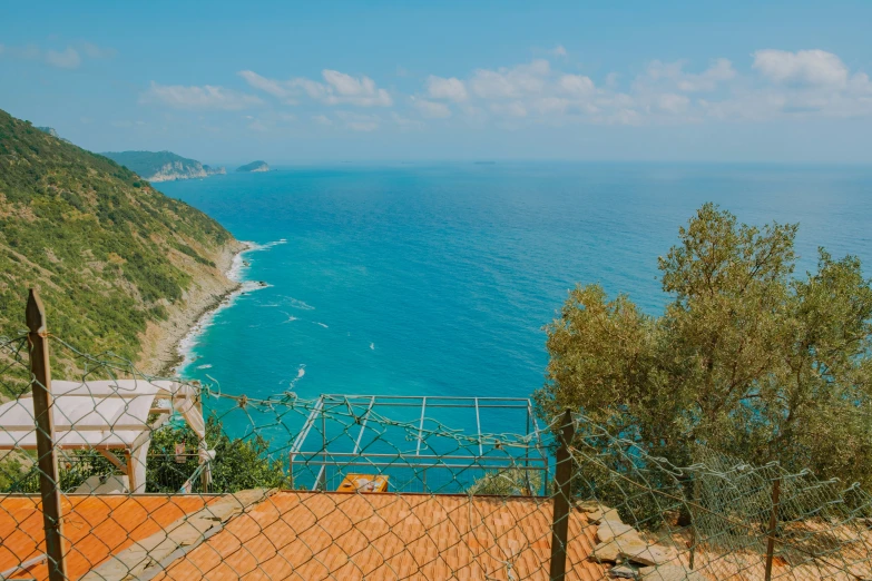 looking down at the ocean with the steps to the cliff