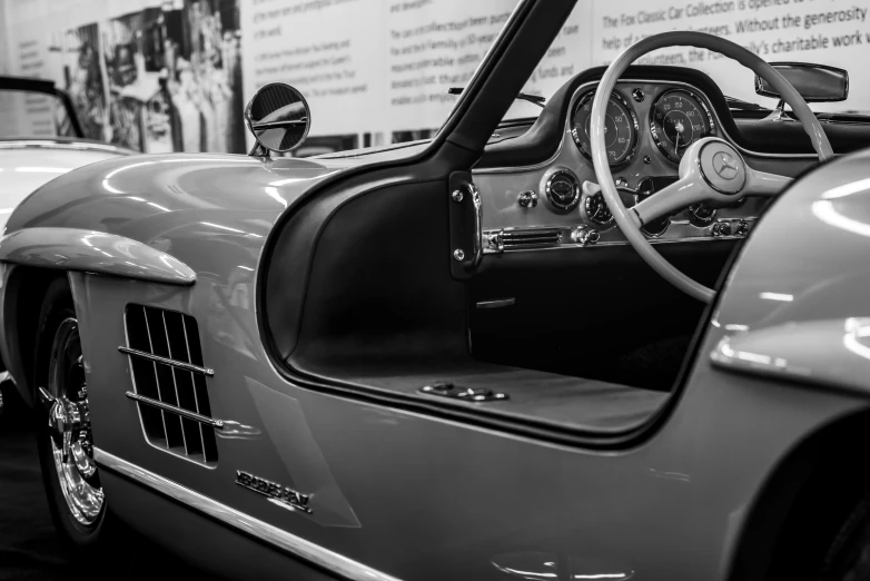 several classic cars parked at the auto show