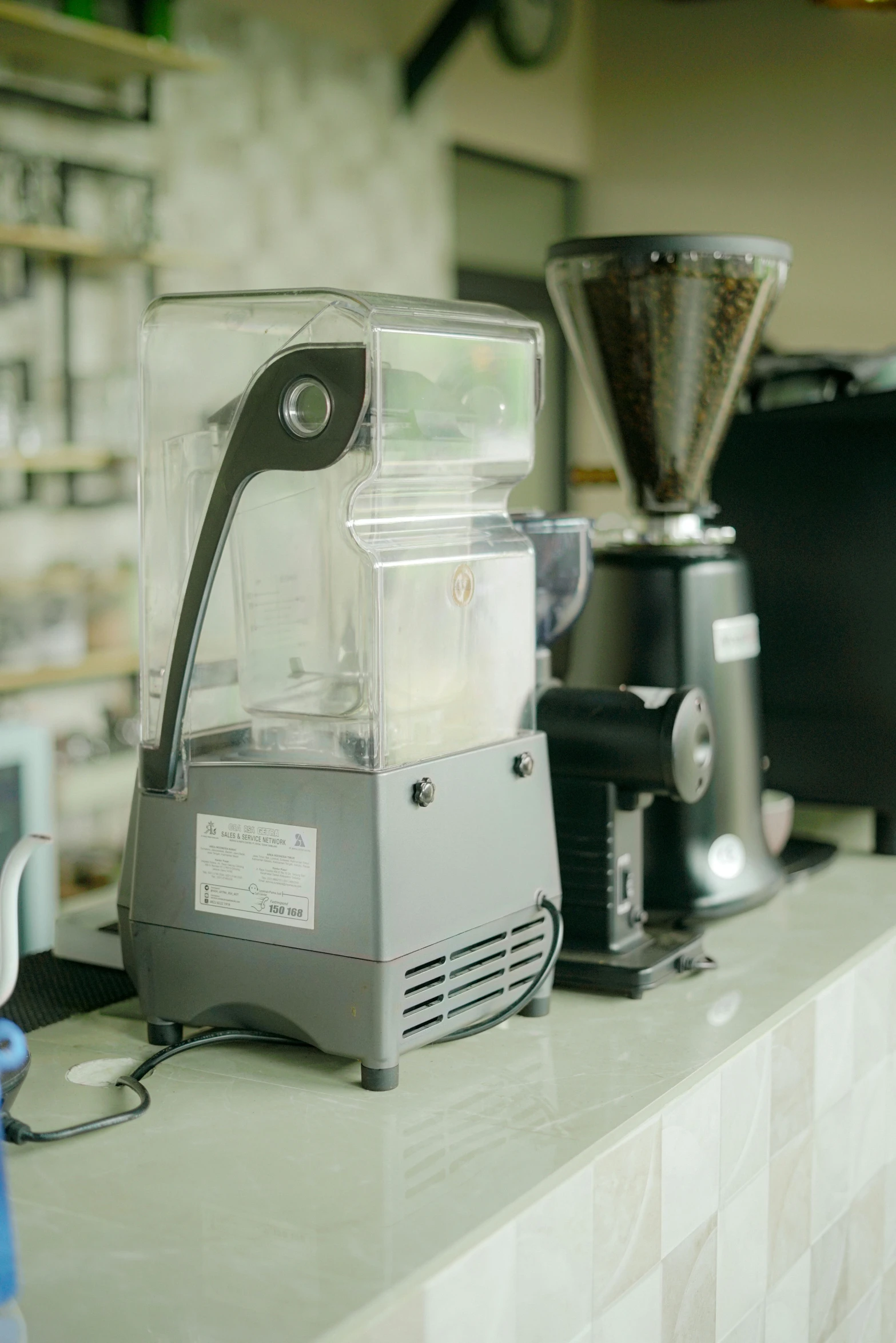 an coffee machine sits on top of the counter in front of other accessories