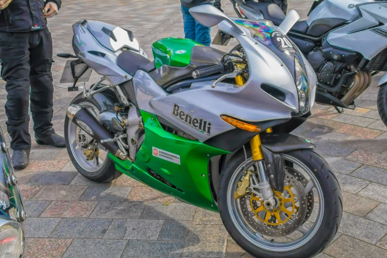 a motorcycle parked next to a group of people