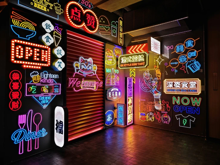 a colorful display with neon signs in the background