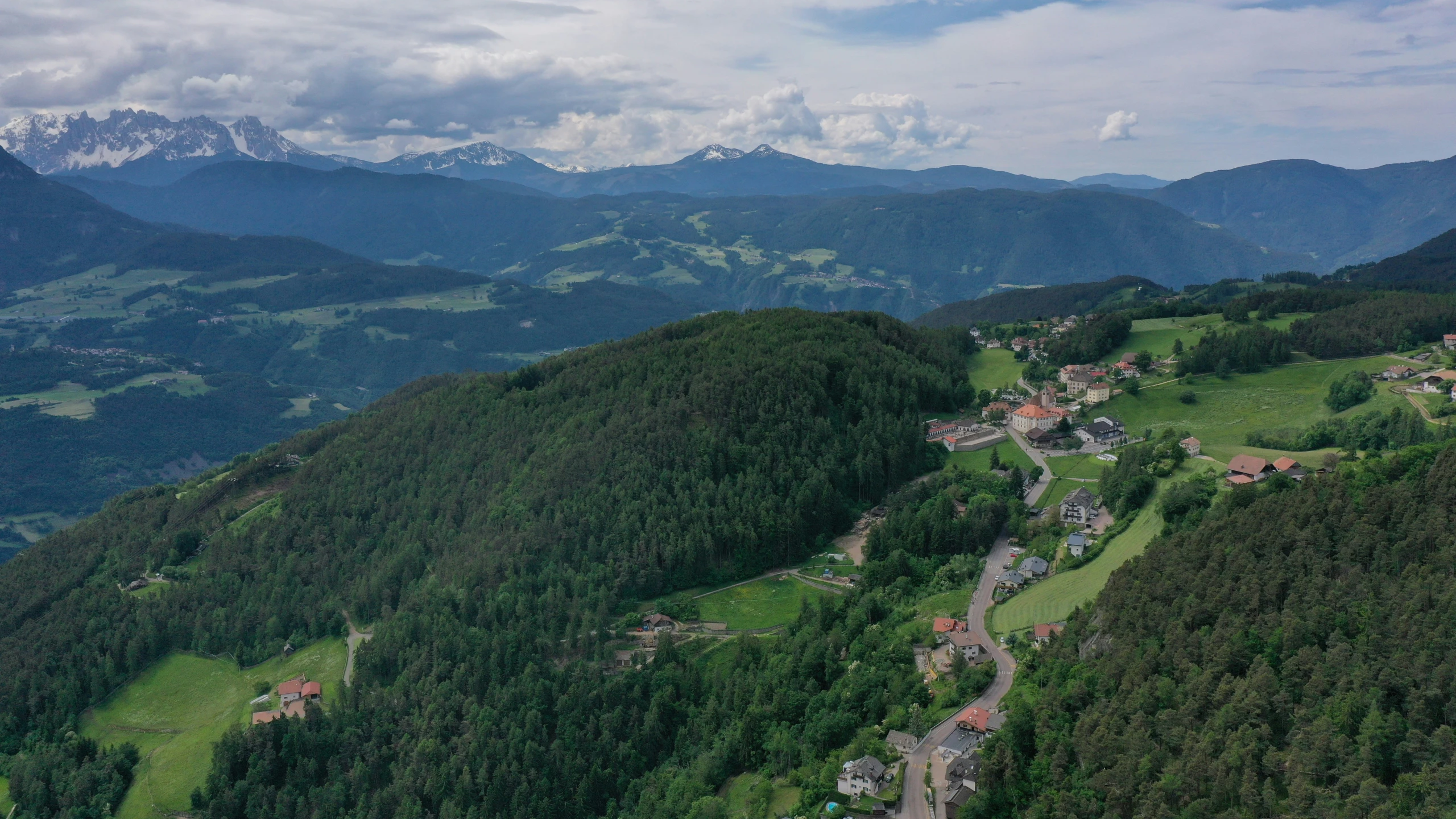 an aerial view of a forested countryside