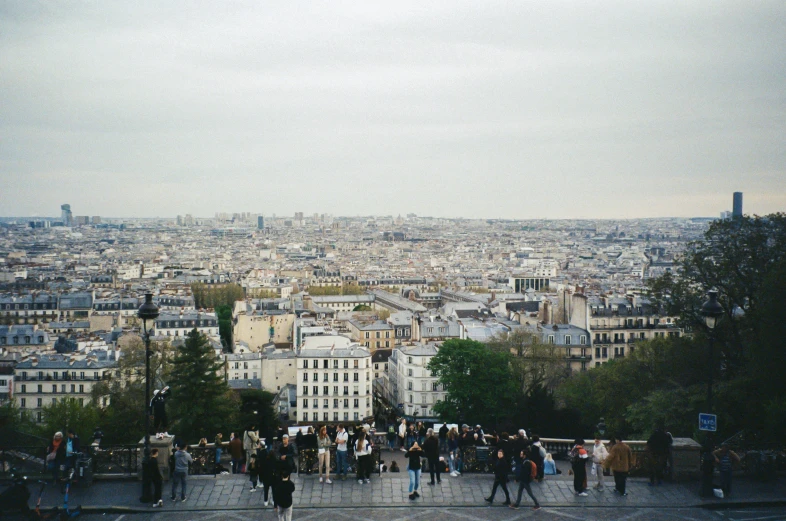 many people are walking up steps to the top of a hill