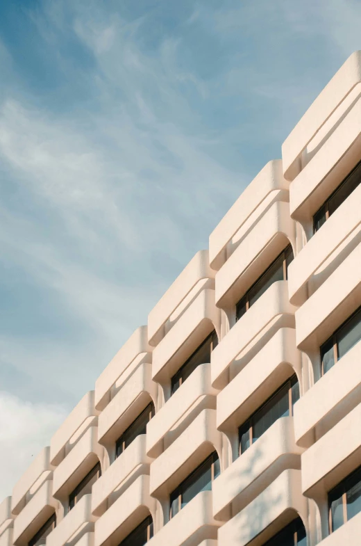 a large building with windows that are facing to the sky