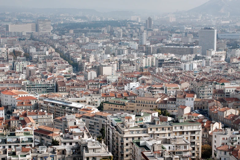 a city with lots of tall buildings and mountains