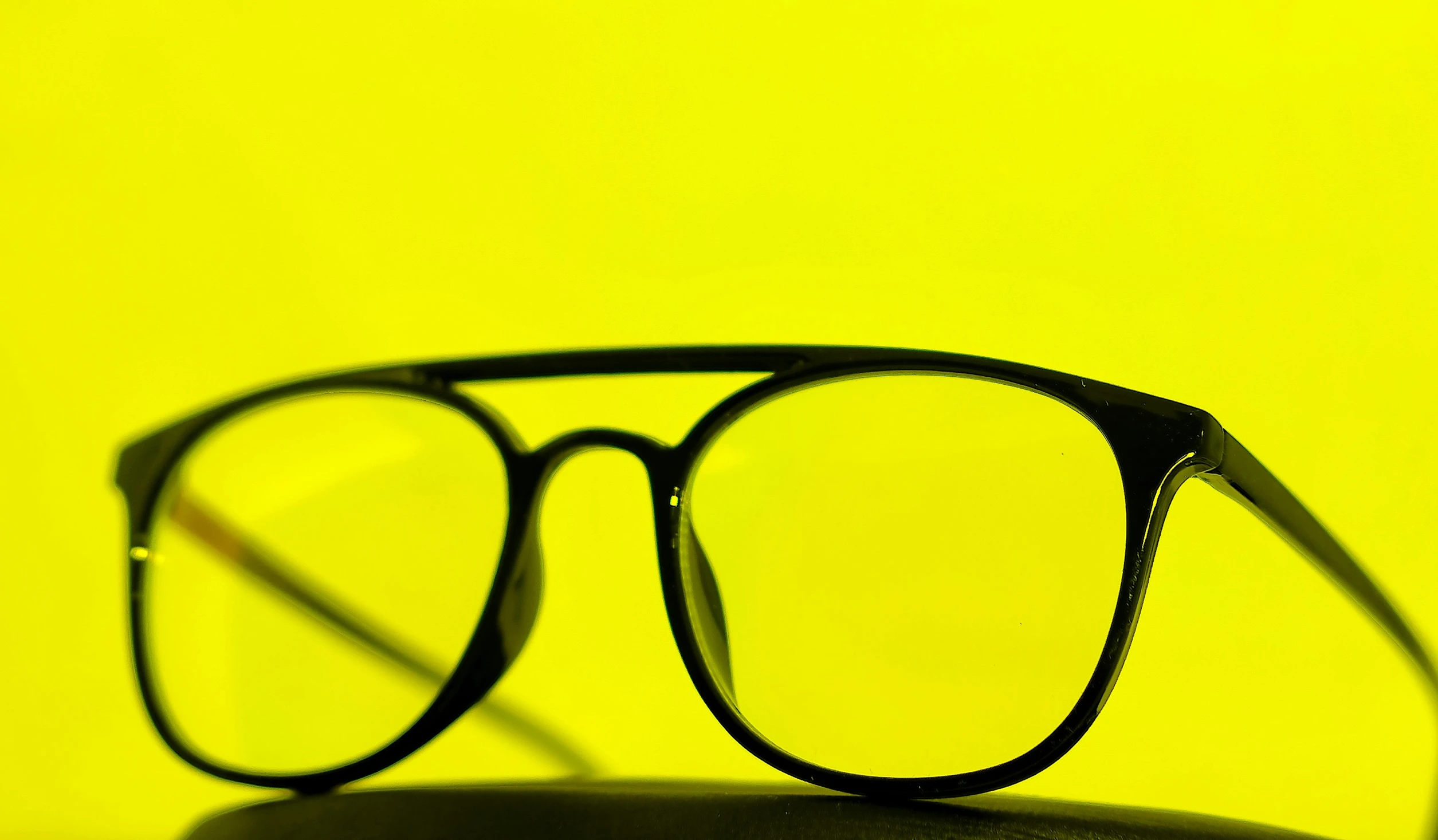 a pair of glasses is sitting on the stand