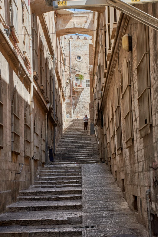 old stone steps with wood frames between buildings