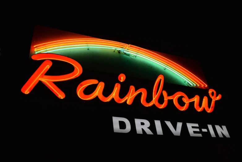 the neon sign reads rainbow drive - in
