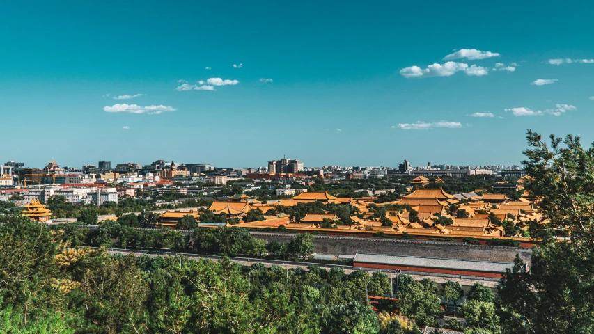 a view of some building type structures from the top of a hill