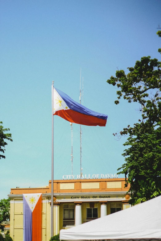 a flag of some sort on top of a building