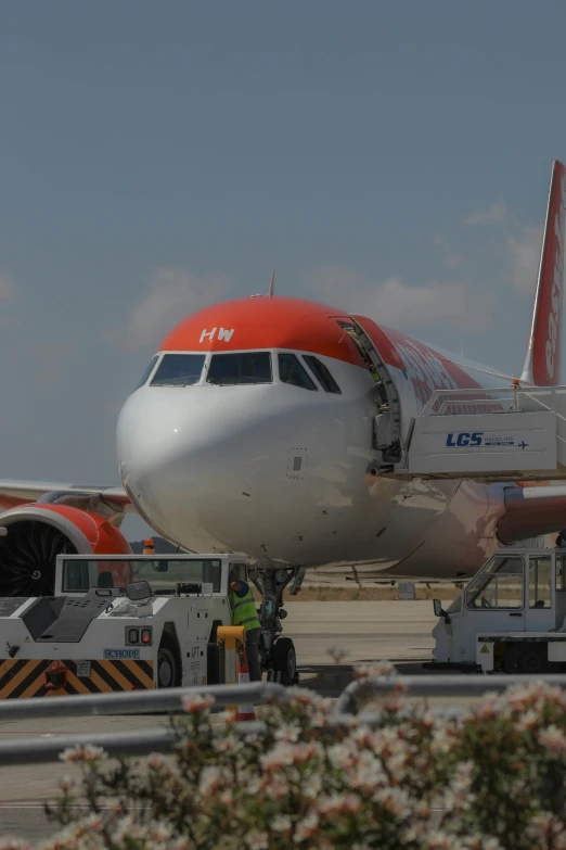 a large commercial jetliner sitting on top of an airport tarmac