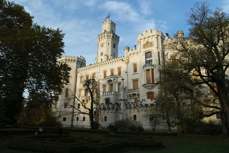 the castle has two towers on top and a clock on the tower