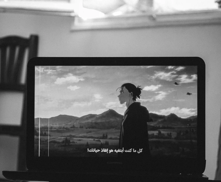 black and white pograph of tv screen with someone watching