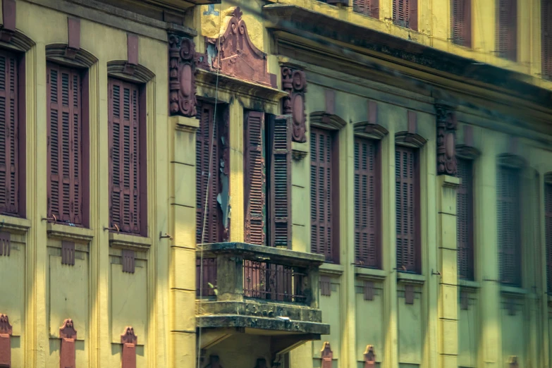 a large building with some people in the doorway and windows