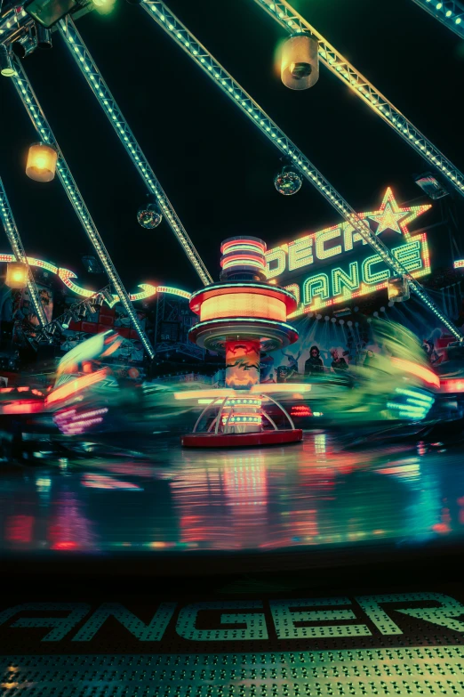 a ride lit up at night with merry go round lights