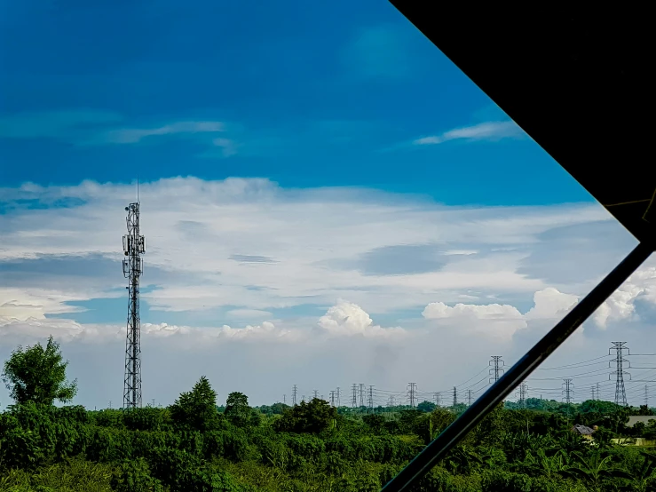 two tower that are sitting in the middle of the woods