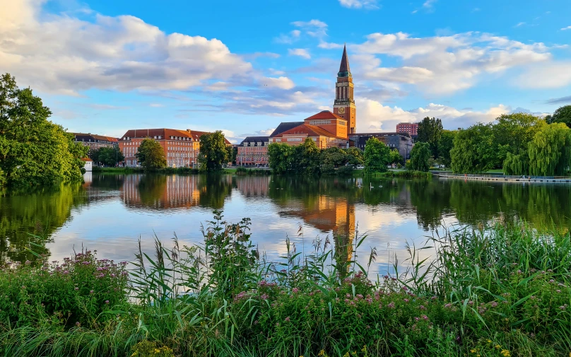 the lake is placid and beautiful, near many houses