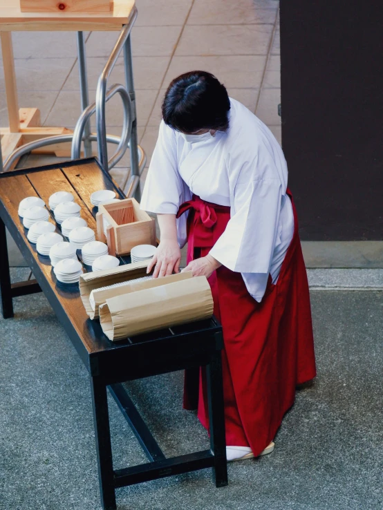 a person with a box on a table