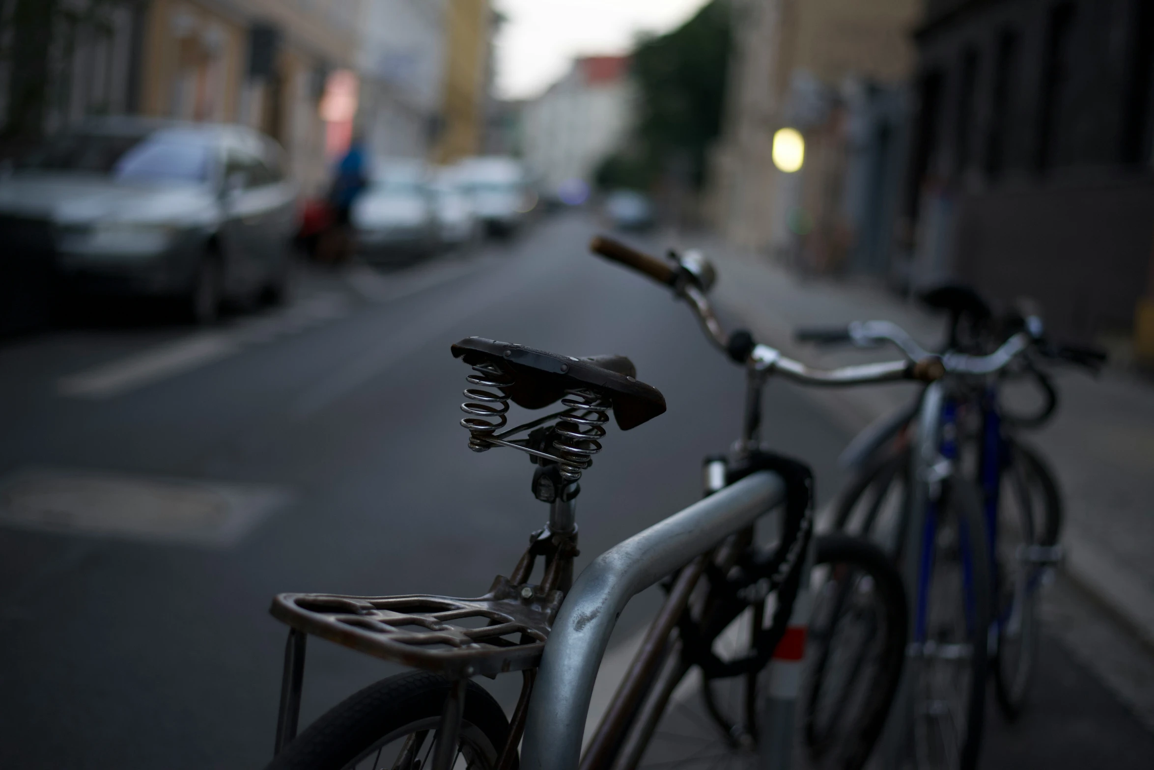 bicycles lined up on the side of the street