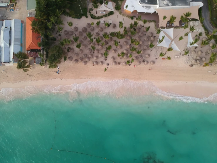 an aerial view of the beach and a resort