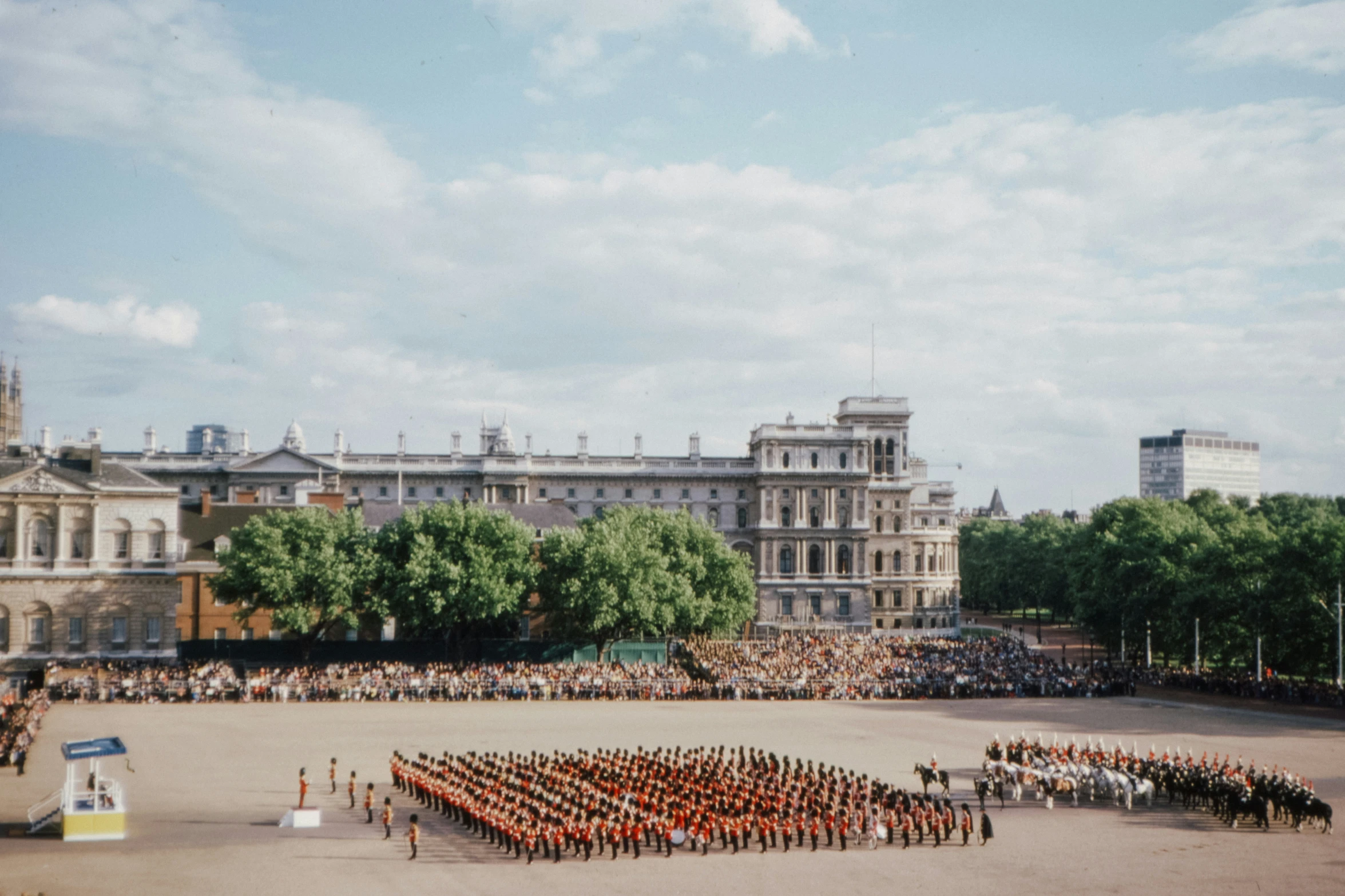 a group of people in uniform standing around a large square