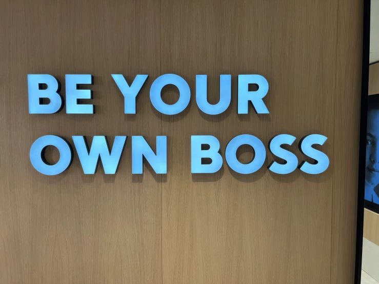 a sign that reads, be your own boss
