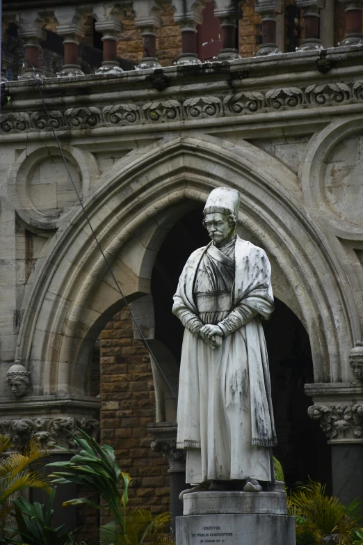 a statue of pope paul is in front of a cathedral